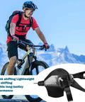 Cyclist riding mountain bike with 9 Speed Right Thumb Gear Shifter For Mountain, Road, Folding And Commuter Bikes With Visual Window And Inner Cable in foreground