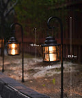 Awesome Four Pack Low Voltage Outdoor Hanging Path Lights Kit Warm White Led Metal Shepherd Hook Lights For Your Pathway Sidewalk And Garden Lighting Includes Wired Cable Connectors, shown along a garden pathway.