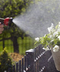 Solid Brass Garden Hose Repair Kit With 1/2 Inch Connectors watering potted flowers with spray nozzle