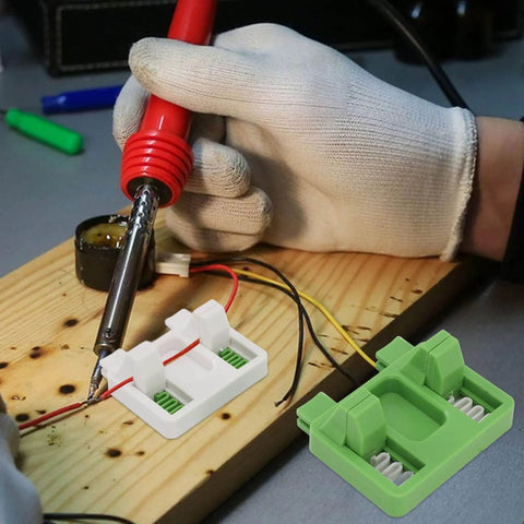 User setting Electric Wire Welding Fixture Clamp Adjustable Soldering Jig For Precise Alignment In MIG TIG And Spot Welds Heat Resistant Insulation Durable Pro Grade Workhorse Easy Setup For Shop Pros Green White Finish on wooden board, shown in use.