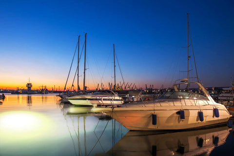 Sick Underwater Led Dock Light With Heavy Duty Fish Attraction Glow No Sweat Plug And Play Install Low Voltage Marine Safety And A Forty Foot Cord That Shines With Straight Fire Brightness For Night Fishing illuminating boats at dusk.