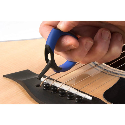 Premium Acoustic Guitar Bridge Pin Puller in use, rubber exterior, one-handed grip, lifting bridge pins safely and smoothly.