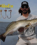 Inshore Jig Head For Soft Plastics With Red Eye And Red Hook 1/4 Ounce 5 Count Pack Perfect For Redfish Speckled Trout Snook Bass Flounder Crappie And More Catches Keepers In 1-6 Feet Of Water shown with angler holding a large fish