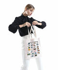Woman holding Civil Engineer Alphabet Tote Bag The ABCs Of Civil Engineering Gift For Female Engineers Graduation Present Durable Canvas Tote
