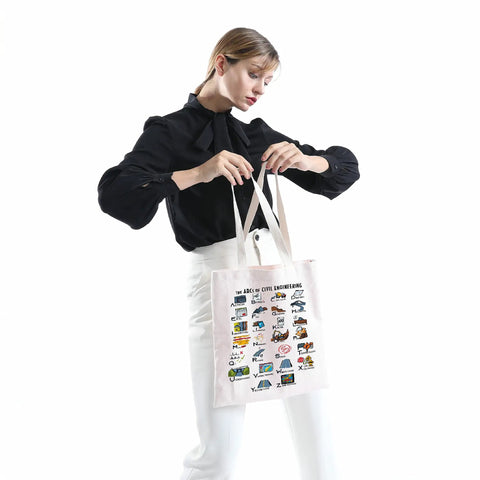 Woman holding Civil Engineer Alphabet Tote Bag The ABCs Of Civil Engineering Gift For Female Engineers Graduation Present Durable Canvas Tote