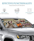 Three Funny Raccoons Windshield Sun Shade For Car SUV Truck 51x27.5 Inches covering front window of a vehicle for heat protection.