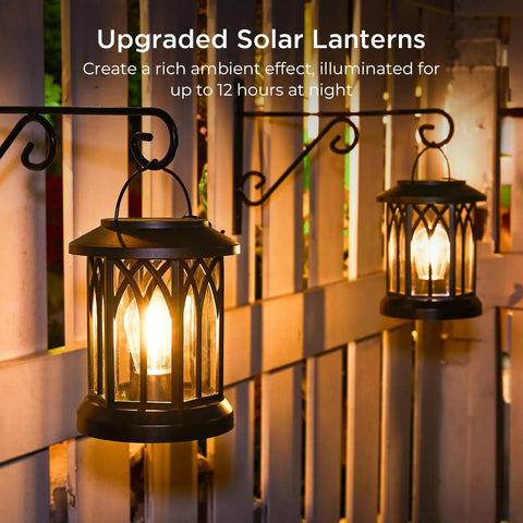 4 Pack Solar Lanterns Outdoor Lights For Garden And Patio, Upgraded Waterproof Hanging Solar Powered Lanterns lit on fence