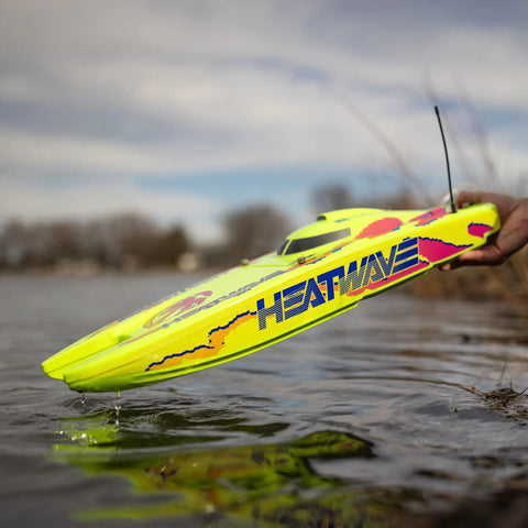 Hand launching Blackjack 24 Inch V2 Catamaran Brushless RC Boat With Heat Wave Visual RTR Ready To Run over water