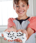 Child holding slime made with White Liquid School Glue 1 Gallon For Arts And Crafts Safe Washable Non Toxic Bond Paper Wood Fabric Ceramics