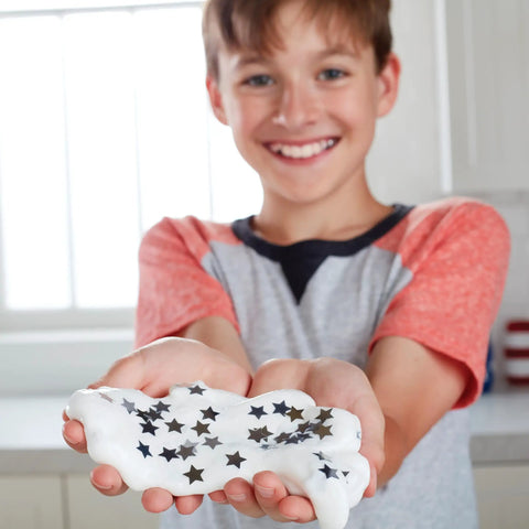 Child holding slime made with White Liquid School Glue 1 Gallon For Arts And Crafts Safe Washable Non Toxic Bond Paper Wood Fabric Ceramics