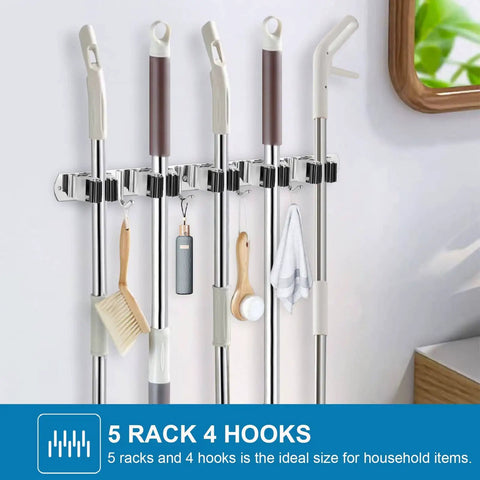 2 Pack Stainless Steel Wall Mount Broom Holder With 5 Racks And 4 Hooks Heavy Duty Self Adhesive Broom Organizer installed on wall