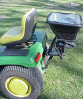 Tow Behind 12V Lawn Tractor Spreader For Grass Seed And Fertilizer With 80 Pound Capacity And Lightweight Frame attached to tractor