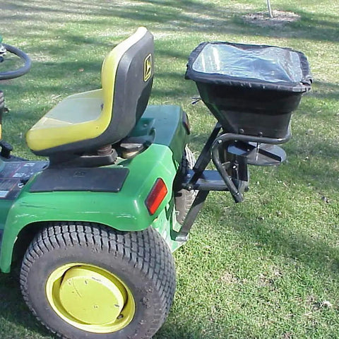 Tow Behind 12V Lawn Tractor Spreader For Grass Seed And Fertilizer With 80 Pound Capacity And Lightweight Frame attached to tractor