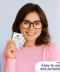 Pikabeast 200-count lens wipes packets held by smiling woman with black-framed glasses
