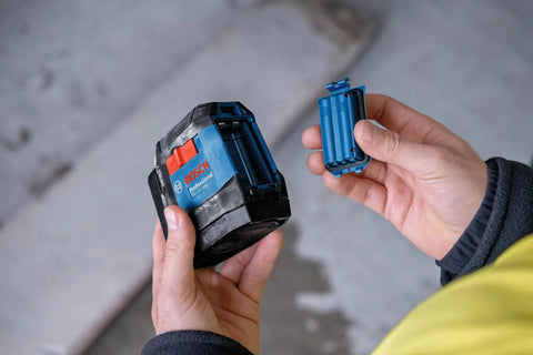 Rechargeable Self Leveling Cross Line Laser With Dual Power Options AA Batteries Or Li Ion Pack IP55 Rugged Jobsite Ready Bright Fine Line Projection For Precise Layouts Quick Setup And Durable Build battery pack and AA tray
