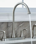 Sleek Brushed Nickel Kitchen Faucet Featuring Pull Out Side Spray Smooth Twist Valves with flowing water on a countertop.
