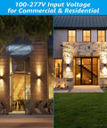 Integrated LED Cylinder Up Down Outdoor Wall Light illuminating a modern patio and residential entrance, waterproof aluminum design.
