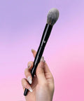 Under Eye Powder Brush Pro Grade With Tapered Tip For Precise Under Eye Application Ultra Soft Synthetic Bristles For Powders Creams And Liquids Smooth Precise Blending And Flawless All Day Finish, black brush held in hand