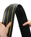 Hands holding a 10 Foot Floor Cord Cover with large cable channels, showing heavy duty PVC material for easy organization and trip hazard prevention.