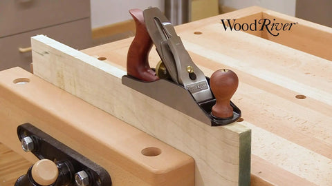 Top Notch Number Three Smoothing Plane For Fine Woodworking Trims on a wood surface, showcasing a cast iron base and hardwood handles.