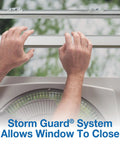 Hands demonstrating Storm Guard on 16-Inch Window Fan With Storm Guard, Built Tough With Impact-Resistant Plastic Housing.