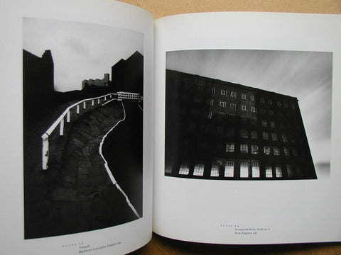 Open book showing moody black and white night urban scenes, from Moody Black And White Night Photography Book Featuring Night Walk By Michael Kenna With 40 Full Page Plates And A 59 Page Softcover Look At Quiet Urban And Rural Nightscapes For Collectors Of Classic Night Imagery.