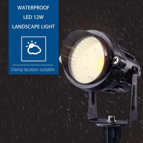 Close-up of Two Pack 12W LED Landscape Lights With Spiked Stands IP65 Waterproof COB Spotlight in rain, warm glow