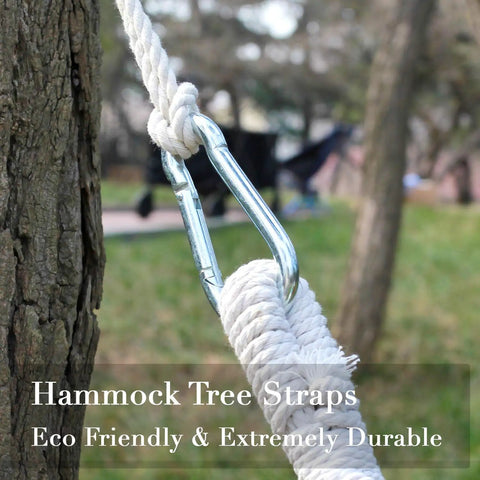 Tree Swing Straps And Hammock Rope Kit, 13 Ft Each With Heavy Duty Carabiner Hooks in use outdoors on tree trunk.