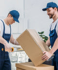 Two workers using Heavy Duty Stretch Wrap With Handles Industrial Strength Moving Plastic Roll Sixty Gauge to secure boxes.