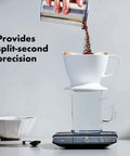 Precision Coffee Scale With Built In Timer For Pour Over, 6 Pound Capacity in use with coffee being poured into filter.