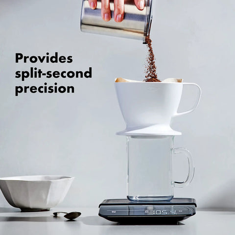 Precision Coffee Scale With Built In Timer For Pour Over, 6 Pound Capacity in use with coffee being poured into filter.