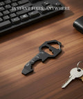 Metal Multi Tool Card With Bottle Opener And Hex Wrench on desk next to keyboard and keys
