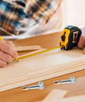 Person measuring wood for DIY with Invisible Cabinet Connector Screws And Nuts Set Four Pack 35mm Easy Install Hidden Fasteners visible.