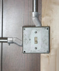 Installed Six Pack Three Quarter Inch EMT Offset Connectors UL Listed Galvanized Steel Conduit Fittings with switch box