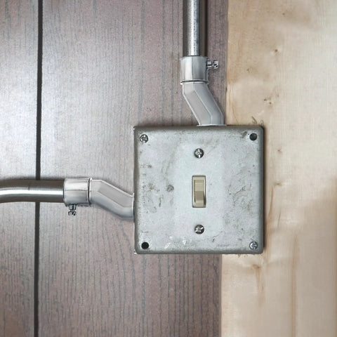Installed Six Pack Three Quarter Inch EMT Offset Connectors UL Listed Galvanized Steel Conduit Fittings with switch box