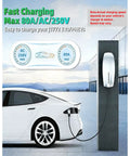 Built Tough Tesla To J1772 Charging Adapter With Secure Lock Ip65 Weatherproof Housing Handles Up To Eighty Amps For Hassle Free Level 2 E V Conversion On Every Road Trip In Black connected to a white electric vehicle.