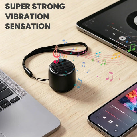 Ultra Tiny Bluetooth Speaker With HD Sound And Deep Bass Mini Wireless Speaker for Phone PC and Tablet on desk with laptops
