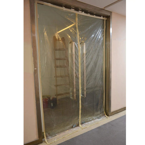 Transparent Magnetic Dust Barrier Door Kit Pro Grade For Construction Containment covering a commercial door opening.