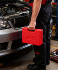 Esakoya brake line flaring tool kit red plastic carrying case side view held by mechanic beside a car