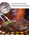 Deep Fry Thermometer With Instant Read Dial, 6 Inch Stainless Steel Stem Meat Thermometer For Oil Fryin, Turkey, BBQ And Grill, Accurate 50 To 550 Degrees Fahrenheit next to steak on grill with fork.