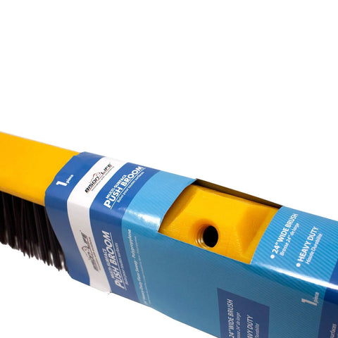 Real Deal Heavy Duty Multi Surface Push Broom Featuring Stain Resistant Coarse Polypropylene Bristles And Solid Plastic Block Head for tough garage chores, close-up view of broom head.