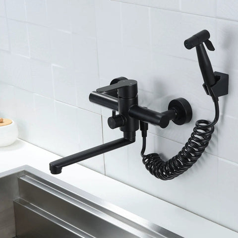 Wall Mount Kitchen Faucet In Matte Black With Side Sprayer, Heavy Duty Stainless Steel Commercial Mixer Tap, installed on wall.