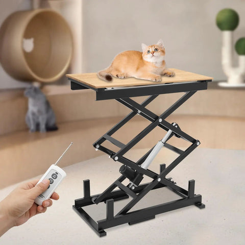 Rock Solid Electric Scissor Lift Table With Adjustable Hydraulic Height remote control, black frame, with a cat on the wooden top.