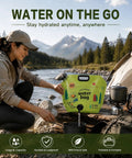 Woman using 2 Gallon Collapsible Camping Water Container With Spout by river, tent and stove visible