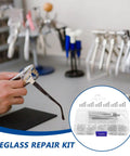 Person using eyeglass repair kit with 527 replacement screws and nose pads, precision screwdriver set, including case with compartments.