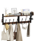 29 Inch Modular Coat Rack Wall Mount With Shelf And Seven Triple Hooks Straight Up Designed To Handle Your Daily Grind Keep Entryway Neat While Grabbing Coats Jackets And Bags On The Fly Brown with hats, bags, and decor items.