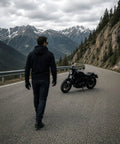 Man on mountain road with motorcycle wearing Streetguard Riding Hoodie With Aramid Armor And CE Shoulder Elbow Protection