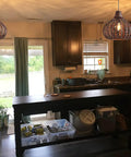 Handwoven Bamboo Pendant Light With Wicker Basket Shade Boho Chic Chandelier For Living Room Bedroom Cafe Teahouse 2 Pack Rustic Natural Rattan Lamps Durable Waterproof Shade illuminating a traditional kitchen interior.