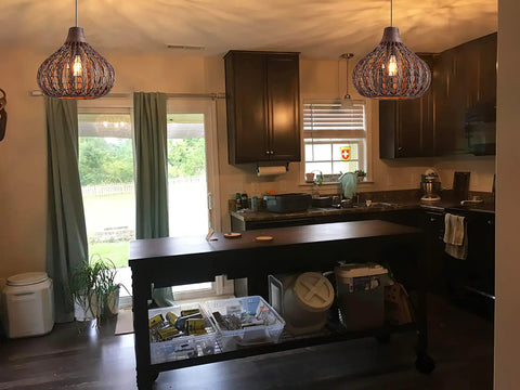 Handwoven Bamboo Pendant Light With Wicker Basket Shade Boho Chic Chandelier For Living Room Bedroom Cafe Teahouse 2 Pack Rustic Natural Rattan Lamps Durable Waterproof Shade illuminating a traditional kitchen interior.