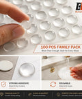 One Hundred Piece Clear Self Adhesive Cabinet Door Bumpers Three Eighth Inches Silicone Rubber Stoppers For Kitchen Drawers And Furniture To Halt Heavy Door Slams Cold Turkey on a sheet, showing adhesive pads.